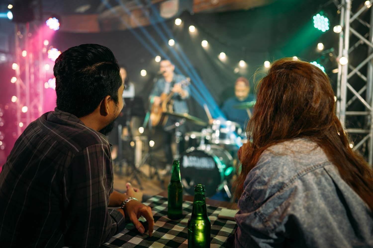 couple watching an intimate gig together couple watching an intimate gig together