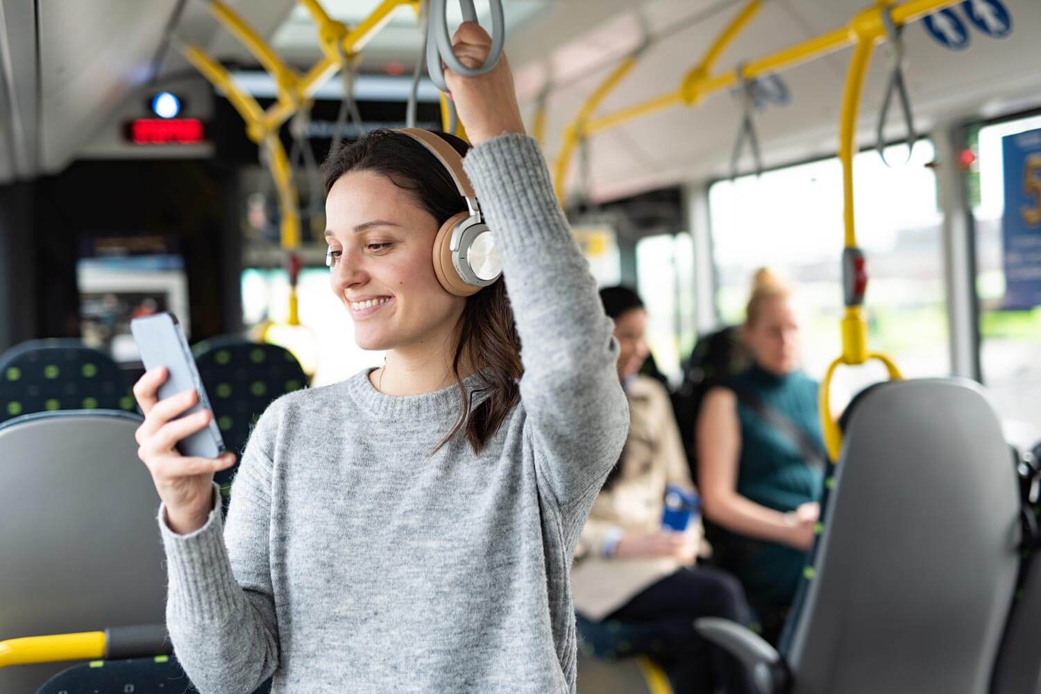 girl on her phone on public transport girl on her phone on public transport