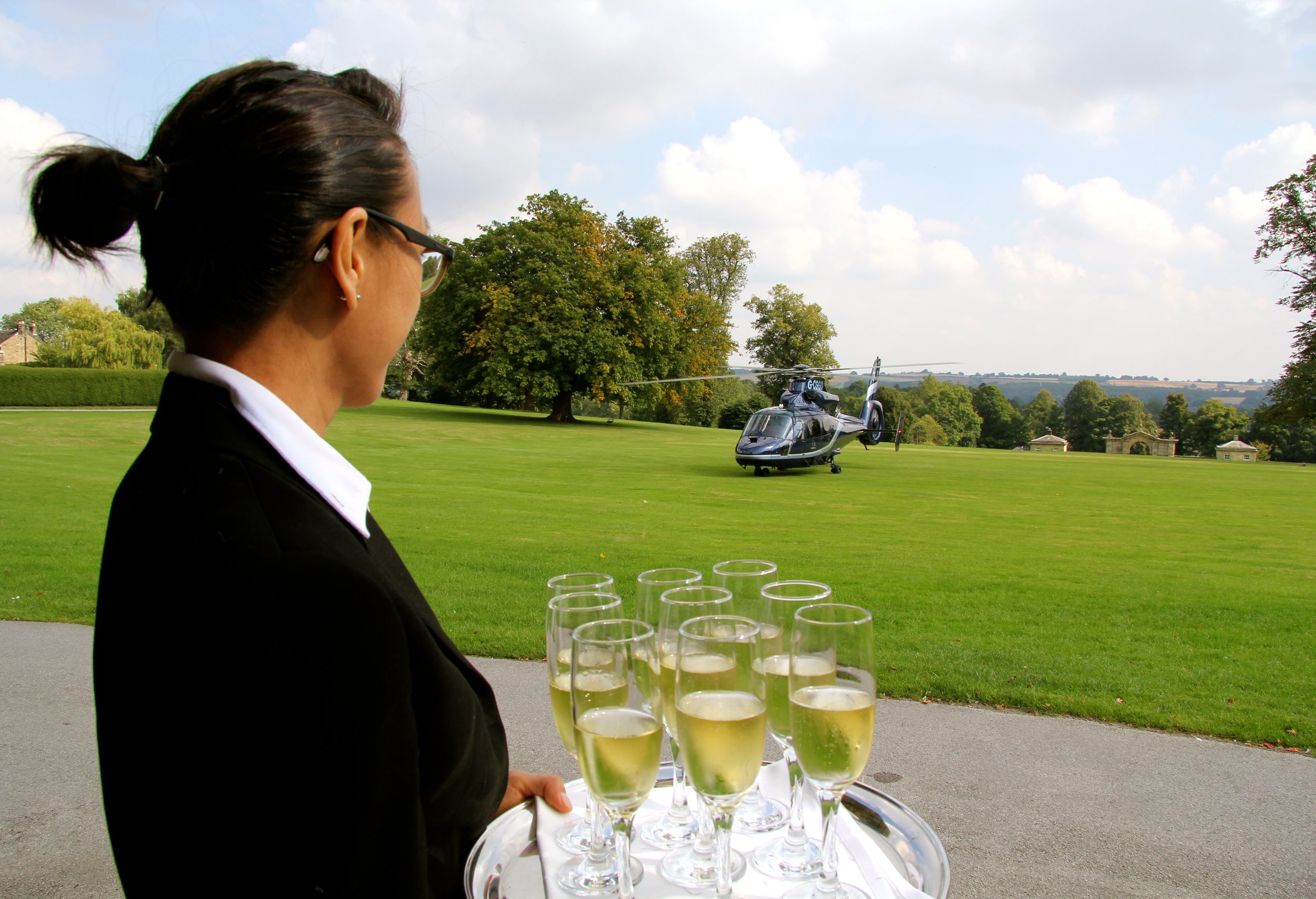 The Needs Group at an event serving drinks
